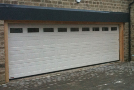 Carteck Georgian sectional garage door with glazing